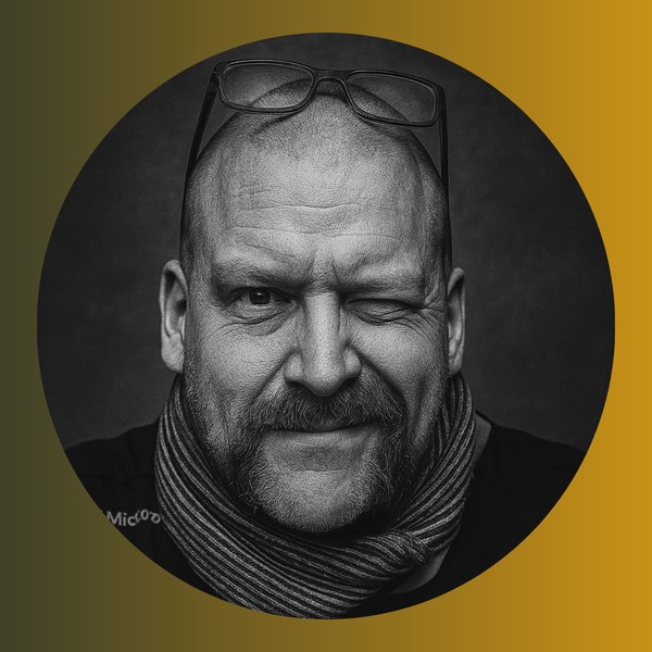 Black-and-white portrait of Leeroy Powell, founder of The CAIO, on a mustard gradient background.